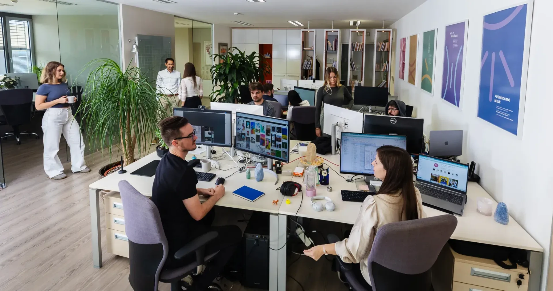 Team working together in a bright open-plan office